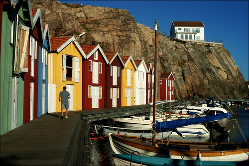 smögen västkusten bohuslän sweden jetty boats quay summer man person house houses 50mm port harbour colourful rock