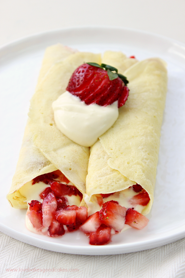 Strawberry & Lemon Cream Crepes on a white plate.