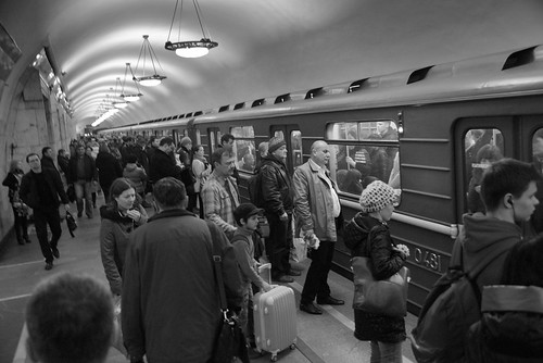 Boarding train at Ploshchad Revolyutsii (Пло́щадь Револю́ции) metro station, Moscow, Russia