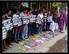 People hold signs reading \