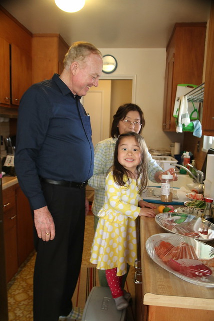 Mio in the kitchen with grandparents