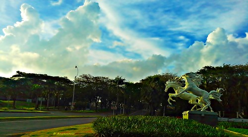 sculpture statue art landscape environment plant trees green sky blue cloud outdoor park surabaya
